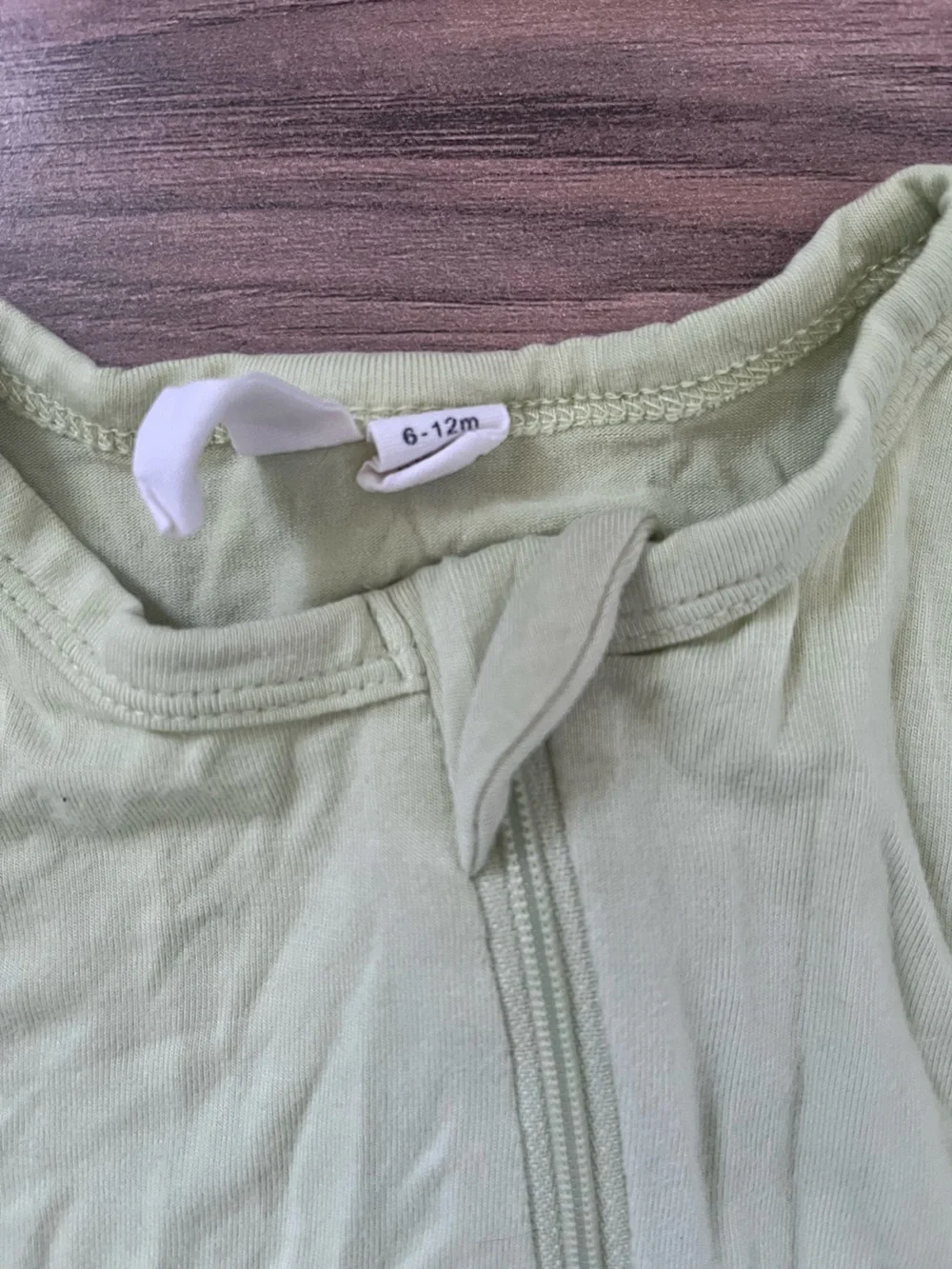 Kyte Baby kiwi footed zip romper